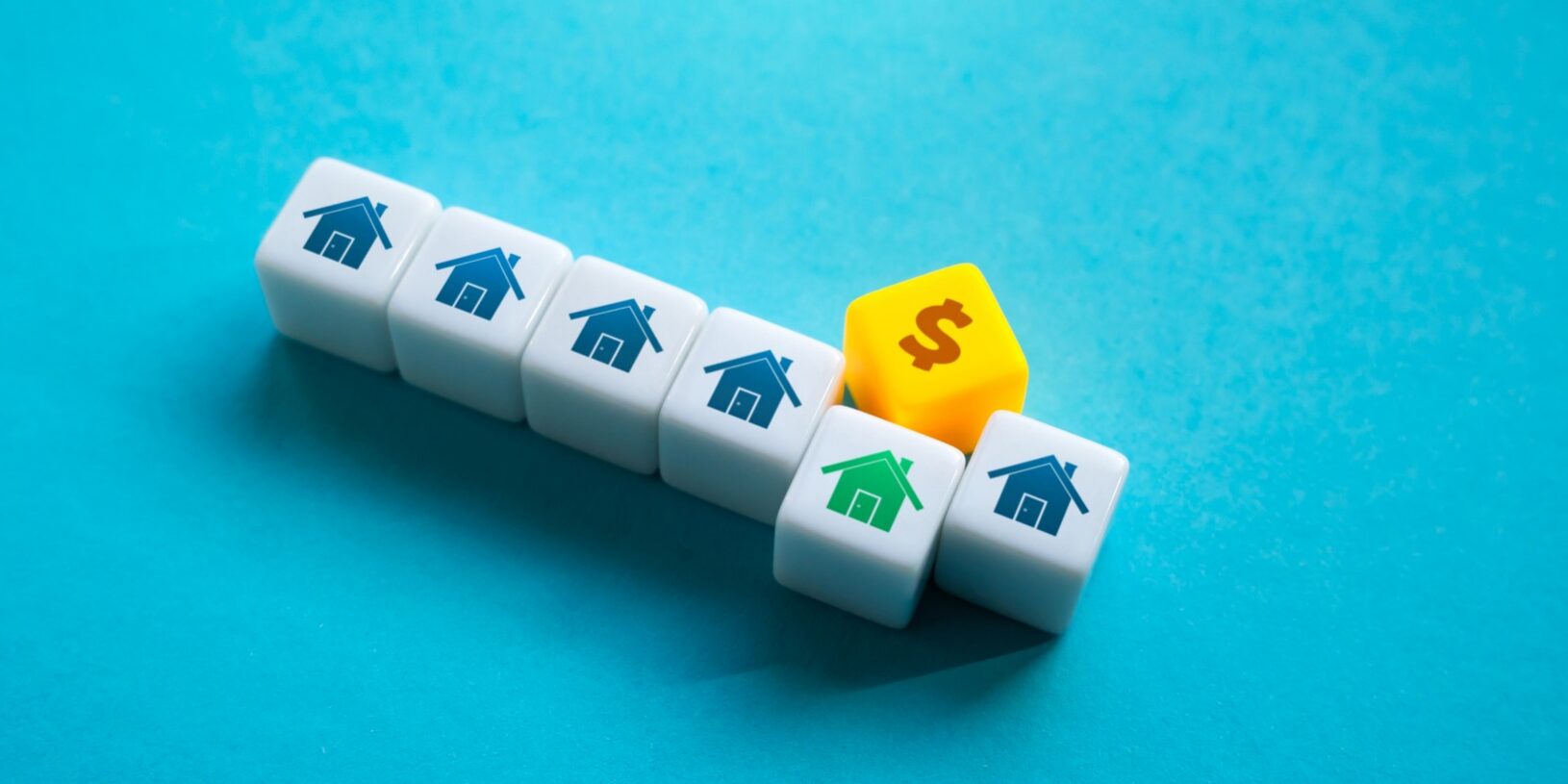 House blocks and a dollar sign illustrating South Florida loan limits for 2026