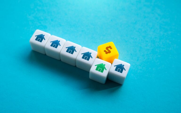 House blocks and a dollar sign illustrating South Florida loan limits for 2026