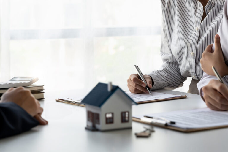 Homeowners meeting a broker to shop multiple lenders before refinancing